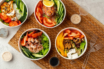 Fresh poke bowl on straw mat close up