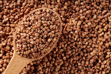 Buckwheat Grains in Wooden Spoon, Copy Space