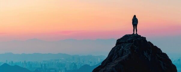 A person standing on a mountain, overlooking a cityscape, symbolizing a view of the world with justice in mind