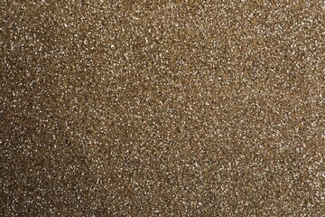 Shiny light brown glitter as background, closeup