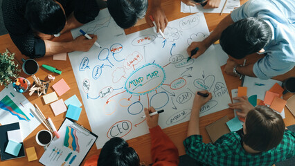 Group of business people writing and making mind map to brainstorming marketing idea at meeting....