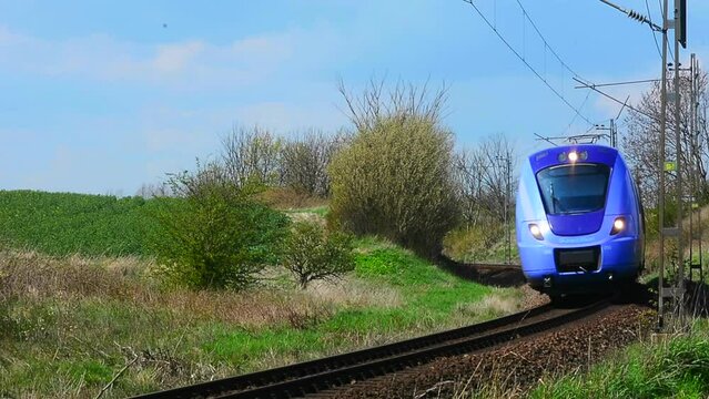 Local train pass through a curve in Ystad municipality, Skane, Sweden, Scandinavia, Europe