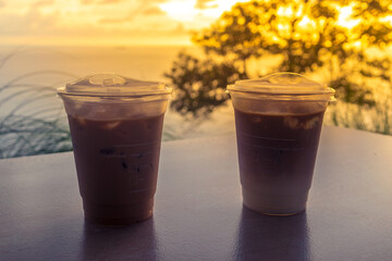Coffee cups with beautiful view of the sea and the beach