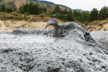 Romania, Buzău County, Berca. Geological ,botanical reservation Vulcanii Noroioși de la Paclele Mici. Small volcano-shaped structures caused by eruption of  natural gases.