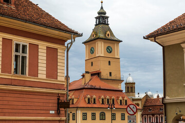 Fototapeta premium Europe, Romania Brasov. Steepled buildings, 16th /17th C. architecture arcaded, terra cotta roofed houses and narrow streets.