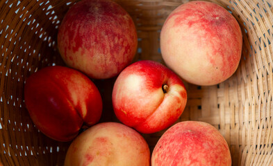 close up peaches in basket