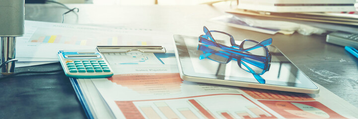 Banner Top view office desk laptop and coffee cup on wood table copy space.  Panorama tabletop...