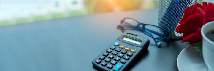 Banner Top view office desk laptop and coffee cup on wood table copy space.  Panorama tabletop...