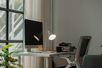 atmosphere inside office with desk, workplace with no people, computer monitor and some stack of document on the desk, empty room but office equipment mockup