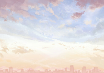 タイトルを乗せやすい余白のある夕暮れ間近の空の背景_ビル群と山脈あり