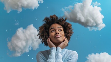 Inspired woman with clouds and blue sky - Young woman looking upwards with clouds and blue sky evoking hope and inspiration