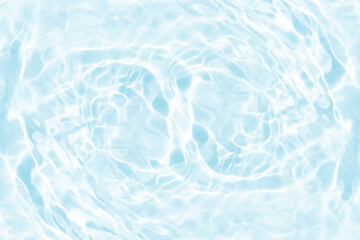 Blue water with ripples on the surface. Defocus blurred transparent blue colored clear calm water surface texture with splashes and bubbles. Water waves with shining pattern texture background.