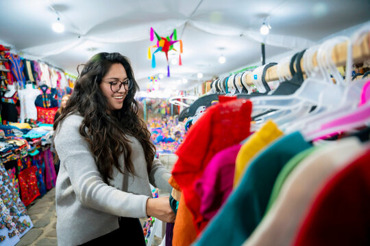 Latin woman shopping at a local market. Market photography in Oaxaca, Mexico. Traditional shopping and lifestyle concept.