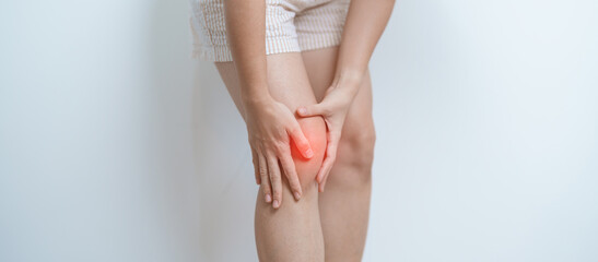 woman having knee ache and muscle pain due to Runners Knee or Patellofemoral Pain Syndrome, osteoarthritis, arthritis, rheumatism and Patellar Tendinitis. medical concept