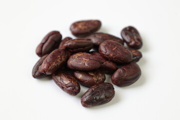 Cocoa beans on white background