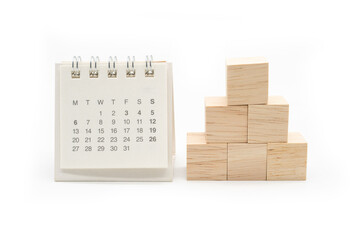 Cube shape wooden block toy stacked in pyramid shape without graphics for Business design concept and calendar. blank wooden cubes.