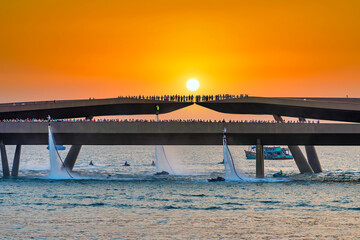 Artists performing Jetski and Flyboard on the water in the sunset town attract many tourists to watch in Phu Quoc, Vietnam