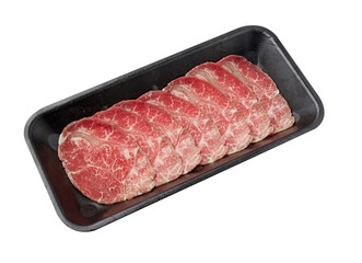 Thinly sliced ​​fresh beef arranged on a black tray isolated on white background.