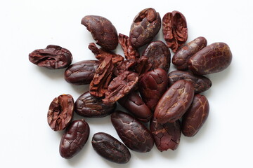 Cocoa beans on white background 