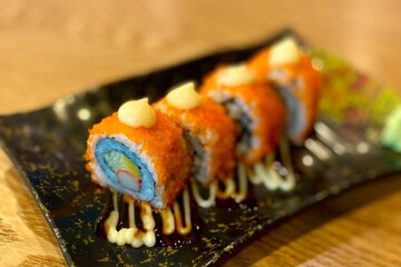 Rainbow Sushi Rolls on a Black Plate