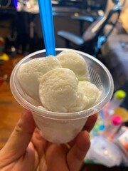 Three Scoops of White Ice Cream in a Cup