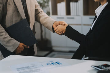 Business handshake for teamwork of business merger and acquisition,successful negotiate,hand shake,two businessman shake hand with partner to celebration partnership and business deal concept