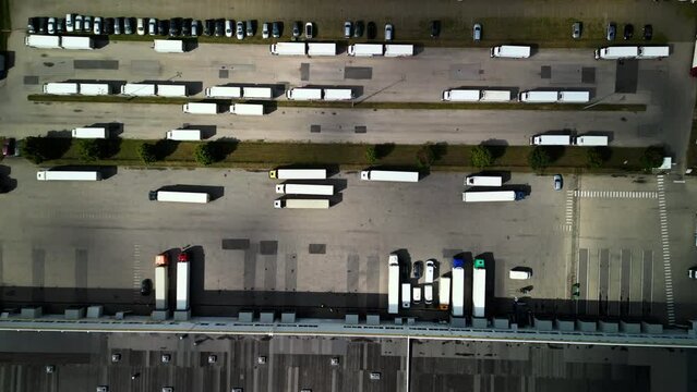 Aerial view showing trucks in logistics park, emphasizing transportation efficiency and supply chain operations