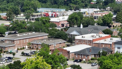 Historic Kingstree, South Carolina downtown buildings, architecture, streets, business, homes in small town USA in the South with shade trees by Black River on Sunny afternoon in summer