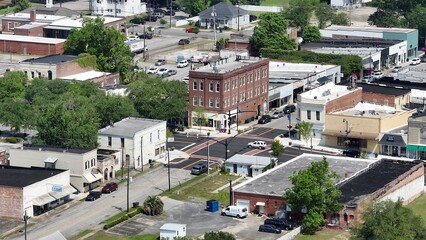 Obraz premium Historic Kingstree, South Carolina downtown buildings, architecture, streets, business, homes in small town USA in the South with shade trees by Black River on Sunny afternoon in summer