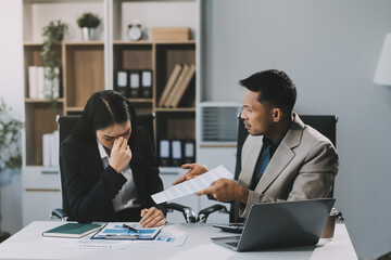 Manager is hard talking with employee in an office. Businessmen arguing at workplace, disagreeing over document, partners having conflict while negotiating, business deal failure