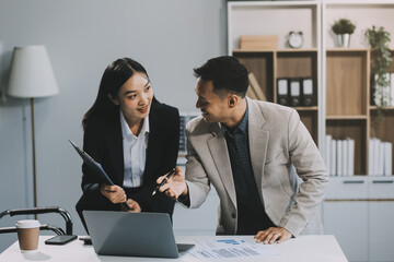 Two happy friendly diverse professionals, teacher and student giving high five standing in office celebrating success, good cooperation result, partnership teamwork and team motivation in office work.