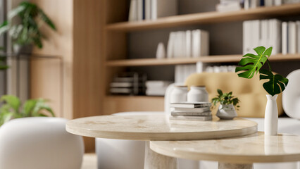A space on a round neutral marble coffee table in a modern, comfortable living room.