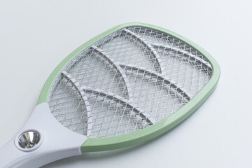 green mosquito swatter isolated on white background