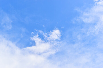 beautiful blue sky and white fluffy group of clouds with sunrise in the morning, natural background
