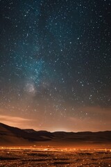 Obraz premium Night Sky Over Desert Dunes with a Spectacular View of the Milky Way and Countless Stars, Capturing the Beauty of the Cosmos in a Serene and Breathtaking Landscape
