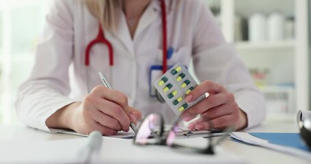 Woman doctor prescribes course of recovery pills to patient - Powered by Adobe