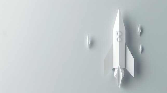 Paper Rocket Launching into a White Sky - A simple, white paper rocket takes flight against a blank background.