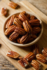Pecan nuts in a wooden bowl