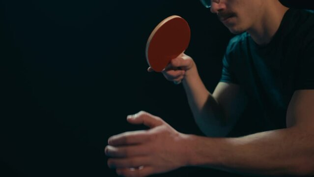 Ping pong player making a service