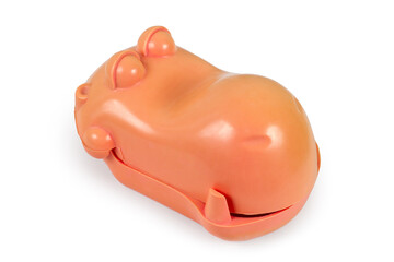 Soap dish in the form of a hippopotamus head on a white background. An old plastic soap dish.
