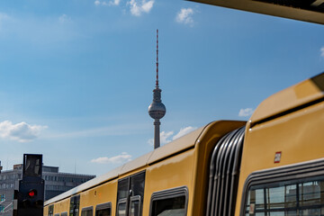 Yellow Berlin metro train on a sunny day. Berlin yellow train.