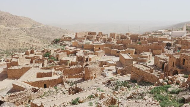 Stone houses of mountainous village of Toujane attracting tourists with traditional architecture 
