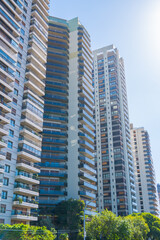 Tall buildings nestled among lush green trees in an urban setting. Buenos Aires, Argentina