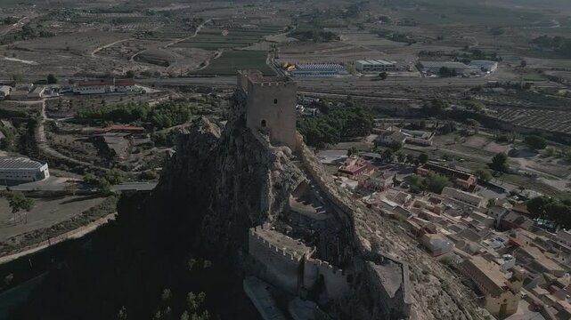 Historic castle on a hill overlooking the town of Biar in Alicante, Spain, aerial view