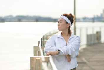 a woman who works out at a riverside park