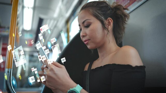 Young woman sits in train and uses her smartphone to watch social media viral videos, posts, blogs and other content