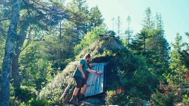A Man Enters a Small Sami Hut - Static Shot