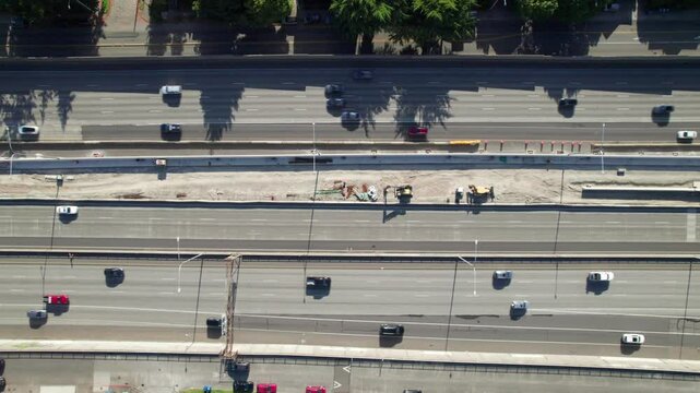 Overheard shot of traffic flow on multi-lane interstate highway, 4K drone clip