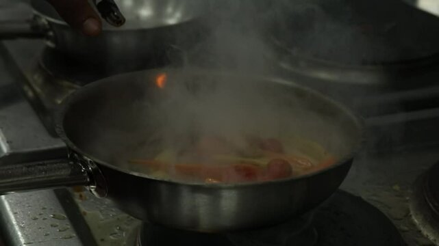 A Chief cooks food on a grill close up shot, insert shot