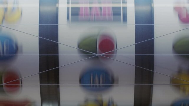 Slot machine in a close up shot of the spinning symbols to a stop of each column of the symbols.
